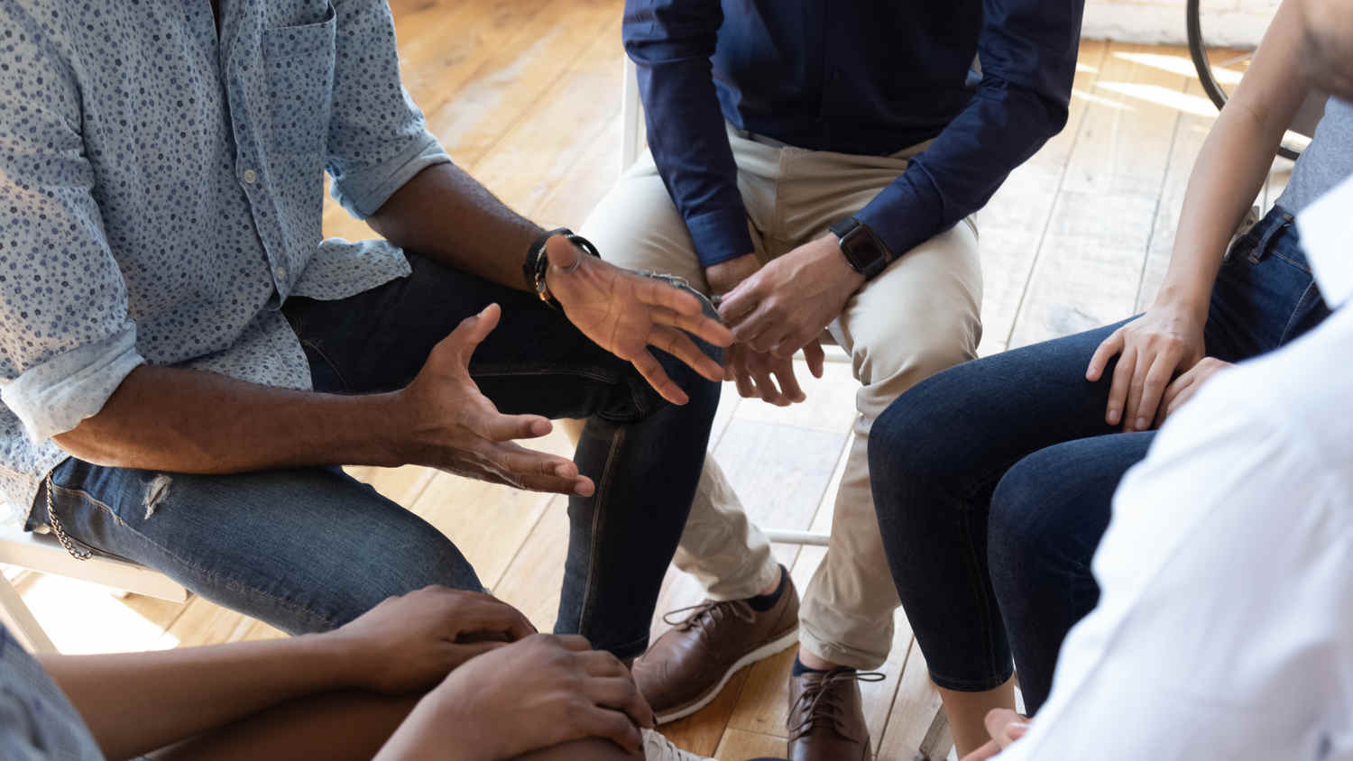 group of people discussing problems in safe circle